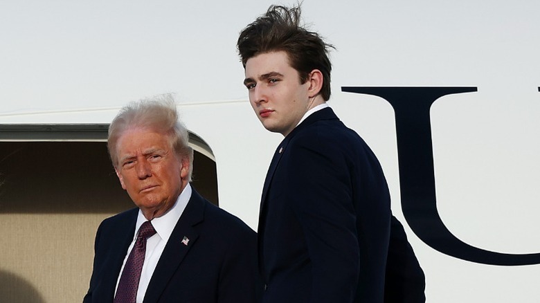 Donald Trump and Barron Trump board a plane in West Palm Beach, FL (2025)