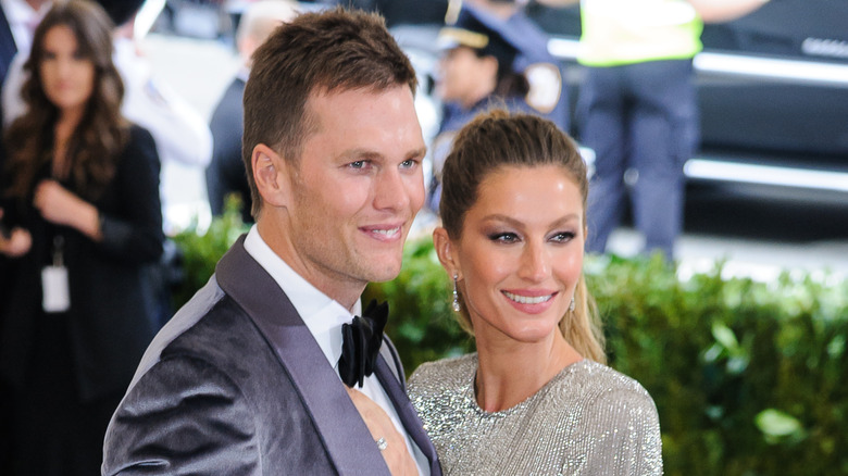 Tom Brady in a tuxedo and Gisele Bündchen in a glittery dress
