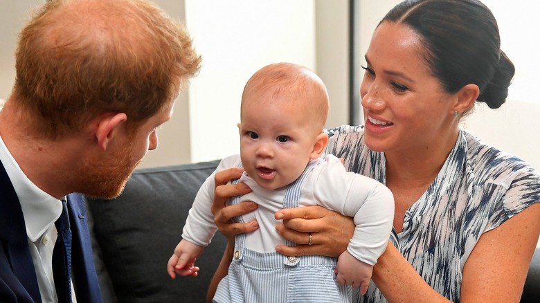 Prince Harry, Duke of Sussex and Meghan, Duchess of Sussex tend to their baby son Archie