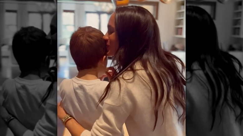 Meghan Markle kissing Prince Archie's hair
