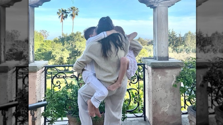 Meghan Markle holding Prince Archie and Princess Lilibet