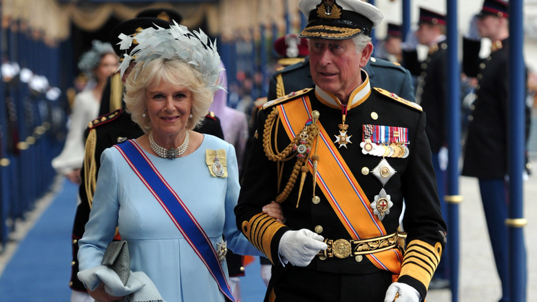 Queen Camilla and King Charles walking in procession