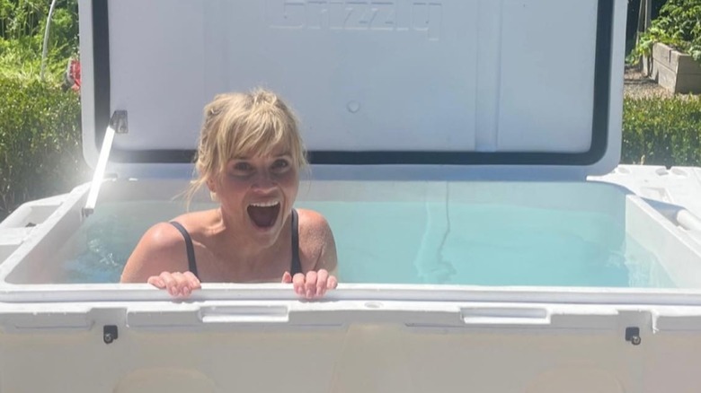 Reese Witherspoon smiling in a tub