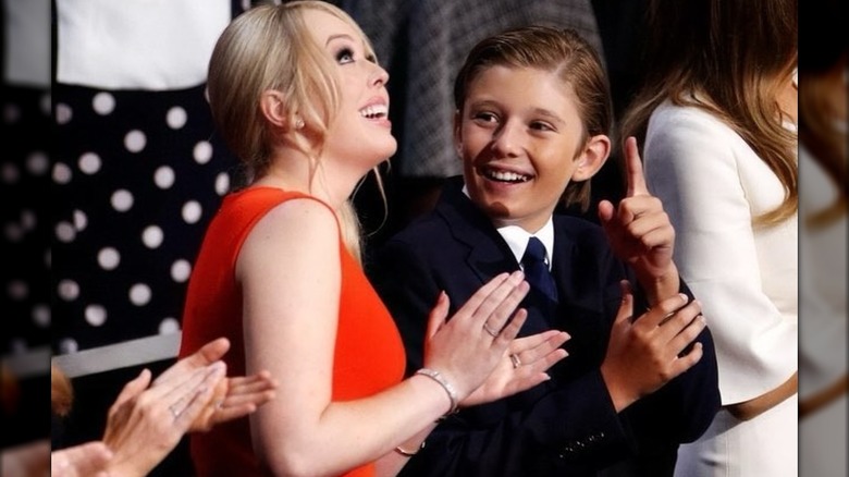 Tiffany Trump applauding and Barron Trump pointing up