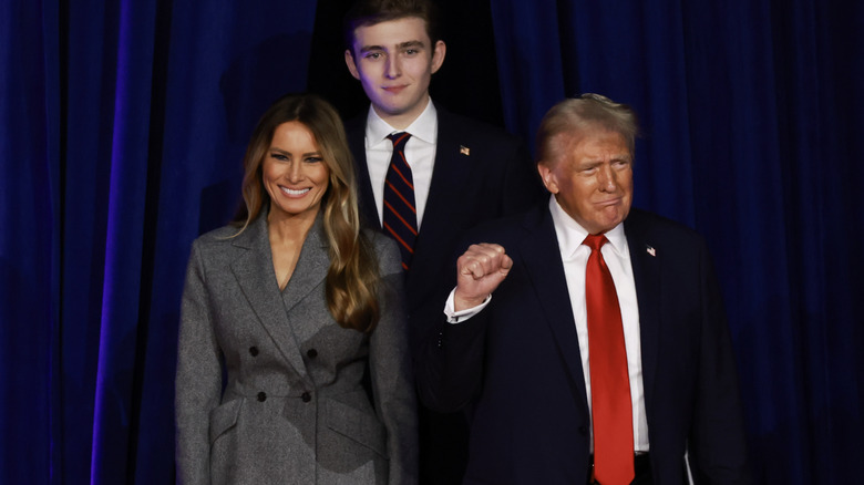 Barron Trump posing with Melania and Donald Trump