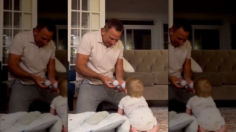 Nicholas Riccio plays with son Niko