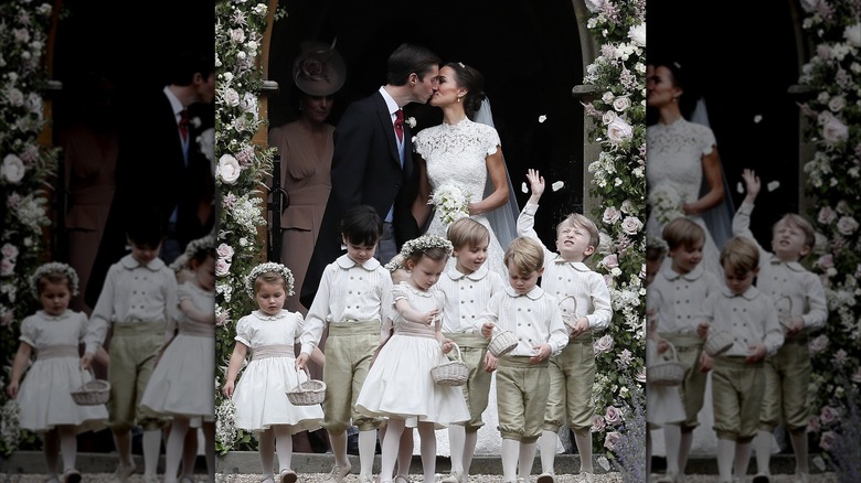 Pippa Middleton and James Matthews sharing a kiss on their wedding day with Princess Charlotte pictured as a flower girl at their feet