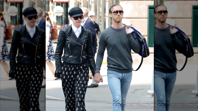Anne Hathaway holding hands with Adam Shulman