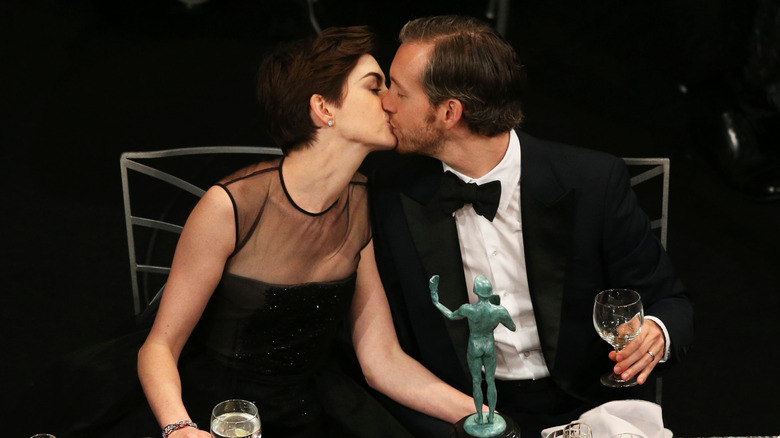 Anne Hathaway kissing Adam Shulman