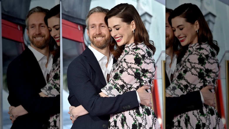 Adam Shulman hugging Anne Hathaway