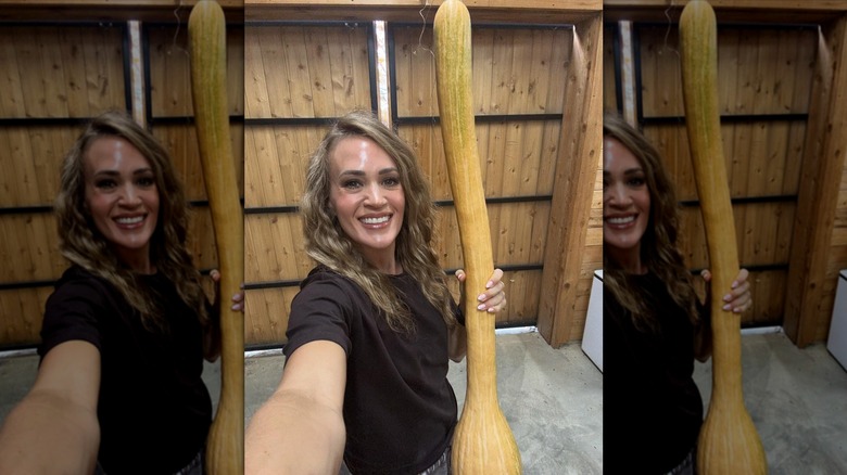 Carrie Underwood smiling with a squash