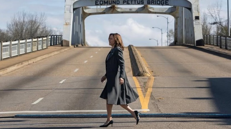 Kamala harris walking in front of the Edmund Pettus Bridge