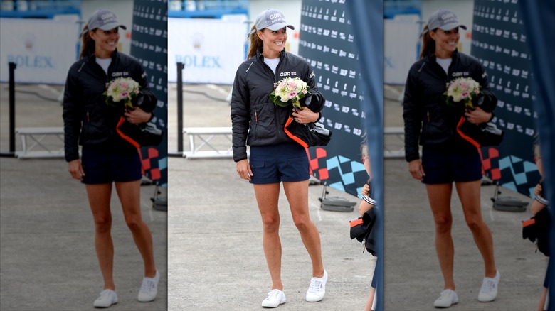 Catherine, Princess of Wales smiling and holding a bouquet