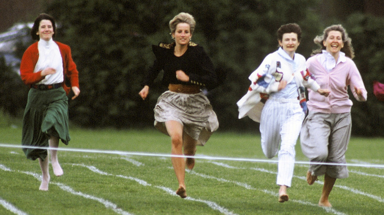 Princess Diana running barefoot in a race at Prince Harry's school