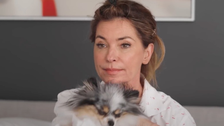 Shania Twain in bed with her dog before going through her morning routine