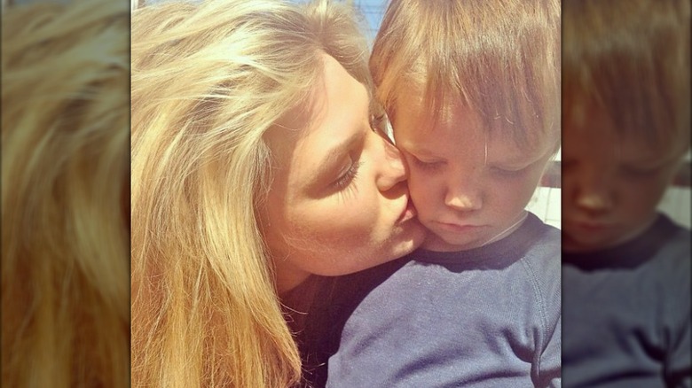 Erika Kirk kissing a child