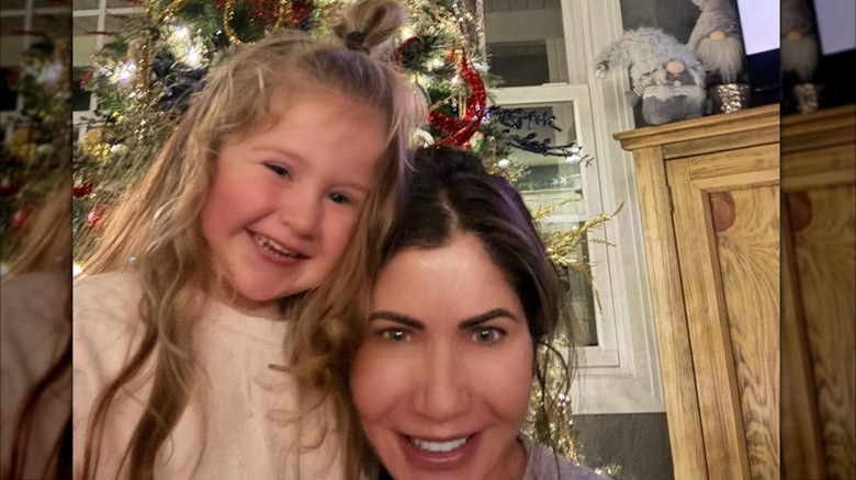 Kristi Noem and Adeline Peters smiling and hugging