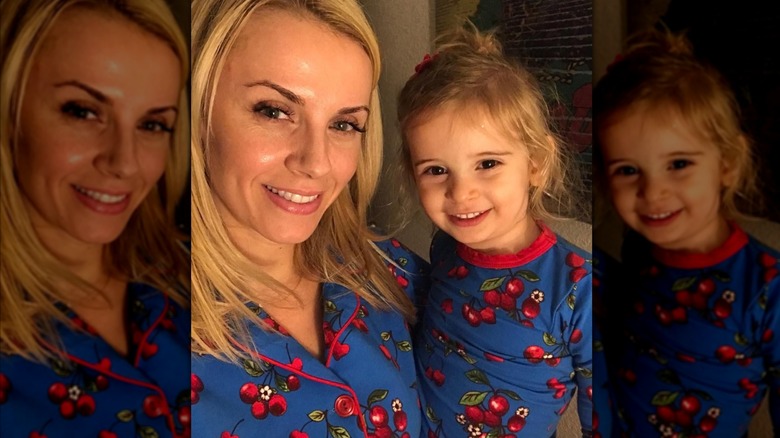 Sara and Frances Wyle wearing matching blue and red cherry-print pajamas