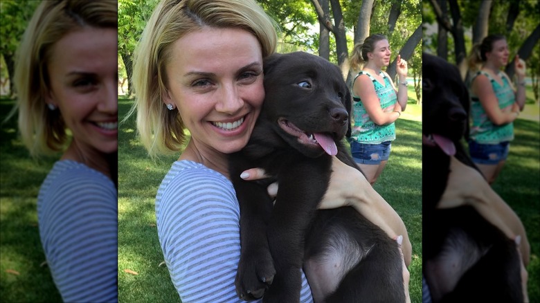 Sara Wyle holding a brown dog