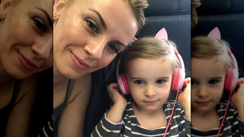 Sara and Frances Wyle posing on a plane