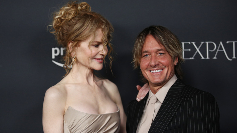 Nicole Kidman looking lovingly at a smiling Keith Urban as they pose for photos together