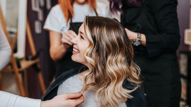 stylists working on client's hair