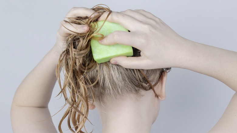 person shampooing hair 