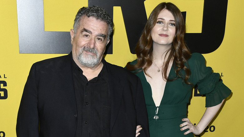 Saul Rubinek and his daughter Hannah pose at the premiere of their show "Hunters"; Hannah has her arm tucked into her dad's