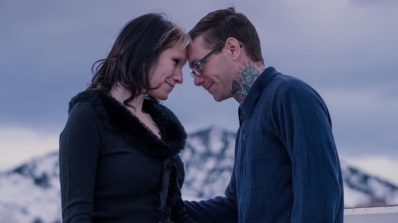 (l-r): Courtney Bonsall and Brian Bonsall smiling and staring at each other outside