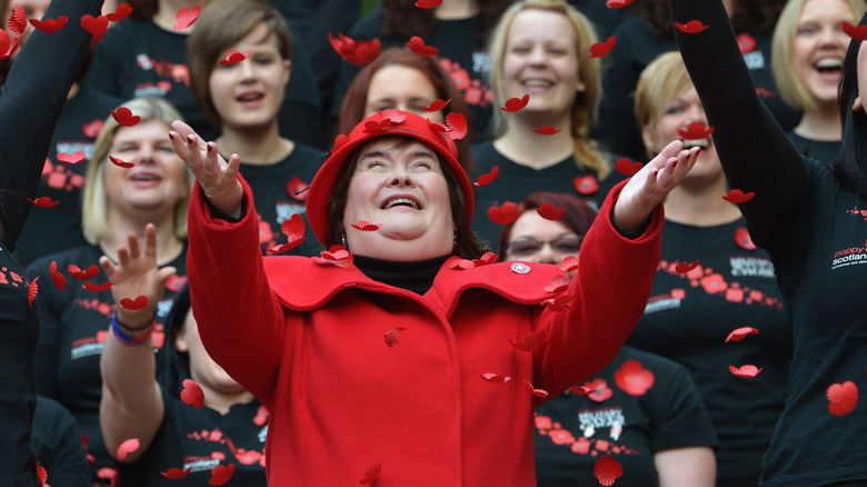 Susan Boyle with red flower petals