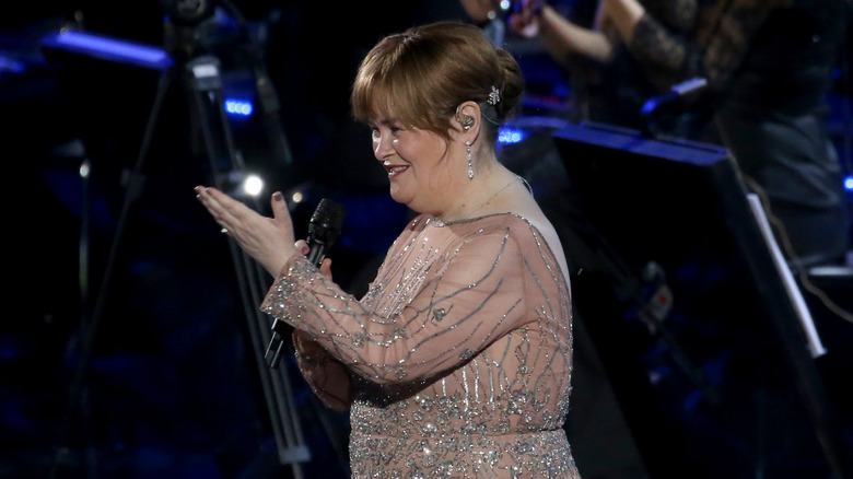 Susan Boyle holding a microphone