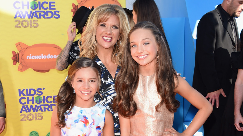 Melissa Ziegler-Gisoni with Maddie and Mackenzie Ziegler at an event in 2015