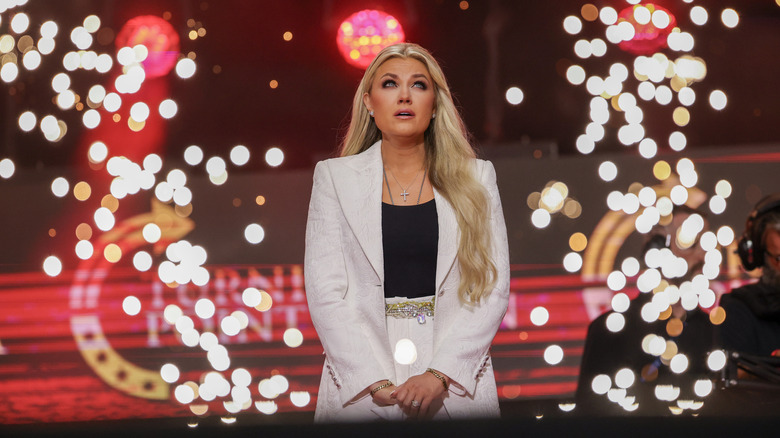 Erika Kirk crying on Turning Point USA stage with fireworks exploding around her