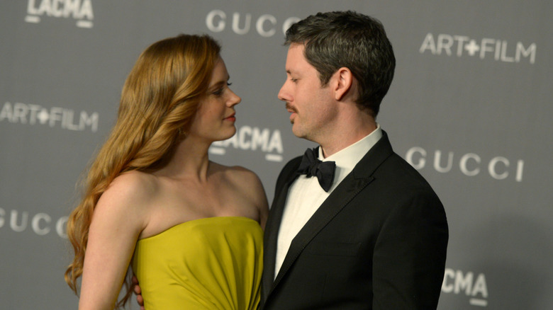 Amy Adams and Darren Le Gallo gazing at each other on the red carpet.