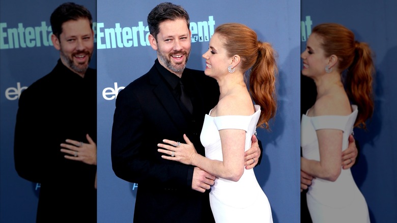 Amy Adams and Darren Le Gallo hugging and laughing.