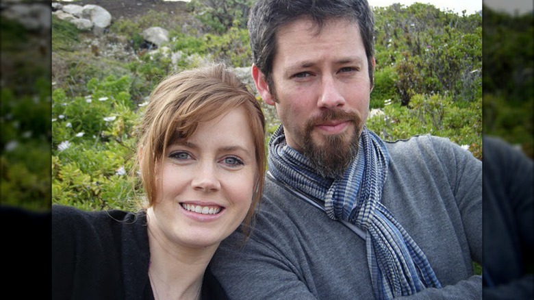 Amy Adams and Darren Le Gallo posing outdoors.