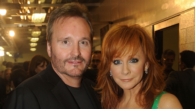Narvel Blackstock and Reba McEntire pose together
