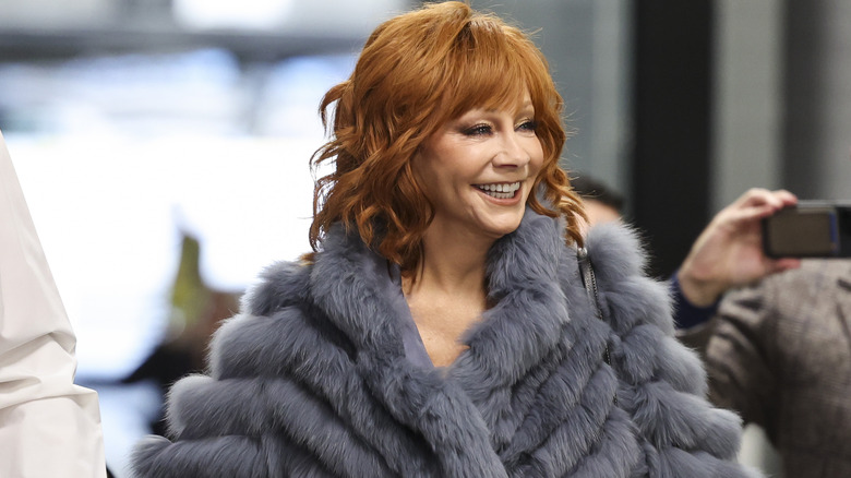 Reba McEntire wearing a fur coat