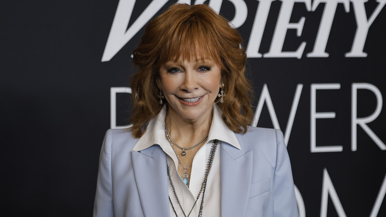 Reba McEntire smiling for photos