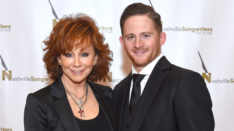 Reba Mcentire smiling with Shelby Blackstock