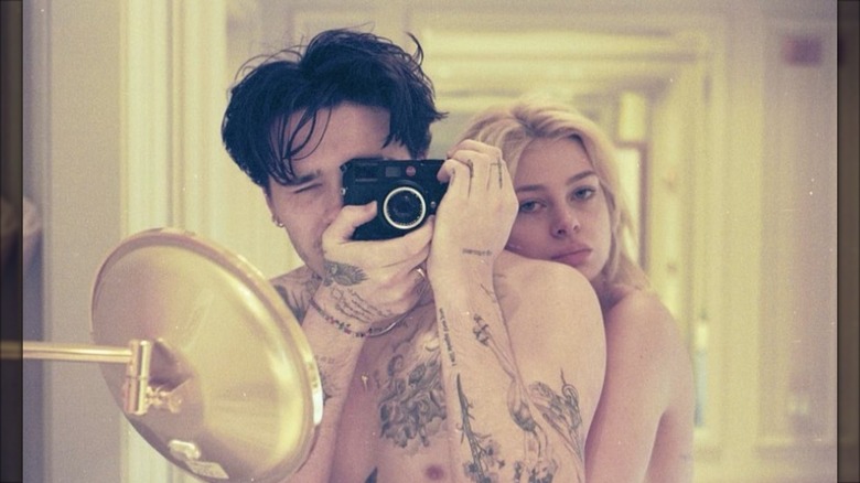 Brooklyn Beckham poses in a photo with his future wife, Nicola Peltz, in a photo he posted to Instagram in October 2021.