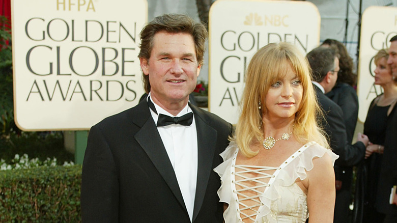 Kurt Russell and Goldie Hawn looking contemplative