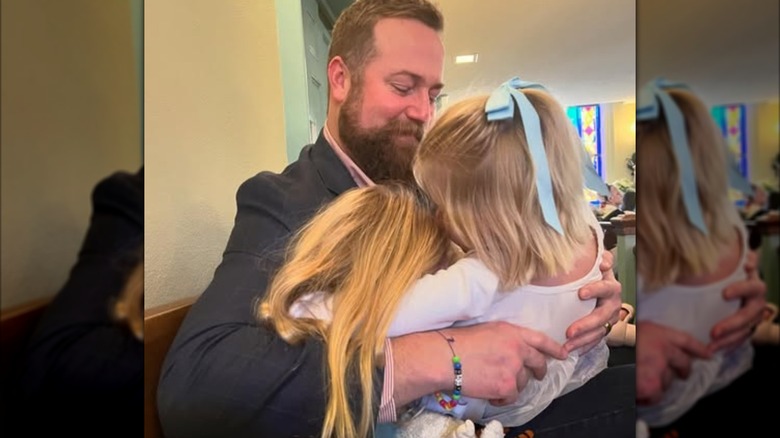 Ben Napier smiling at his daughters in a photo posted to Instagram by Erin Napier in December 2024
