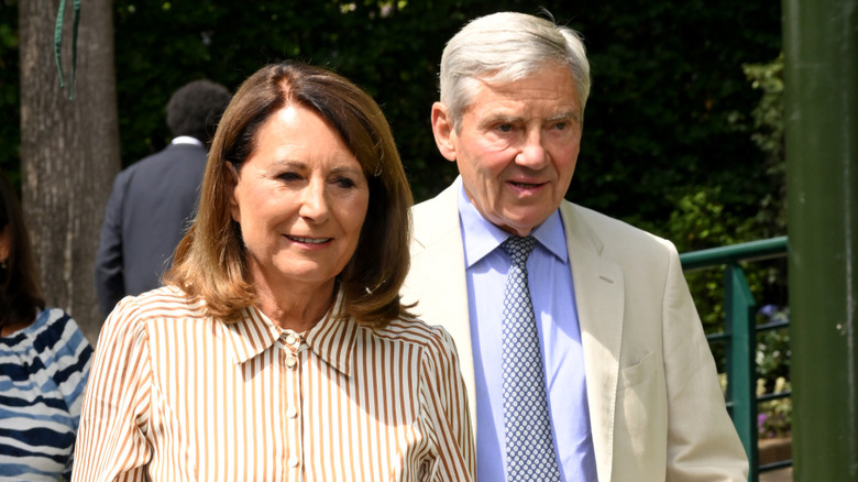 Michael Middleton walking behind Carole Middleton
