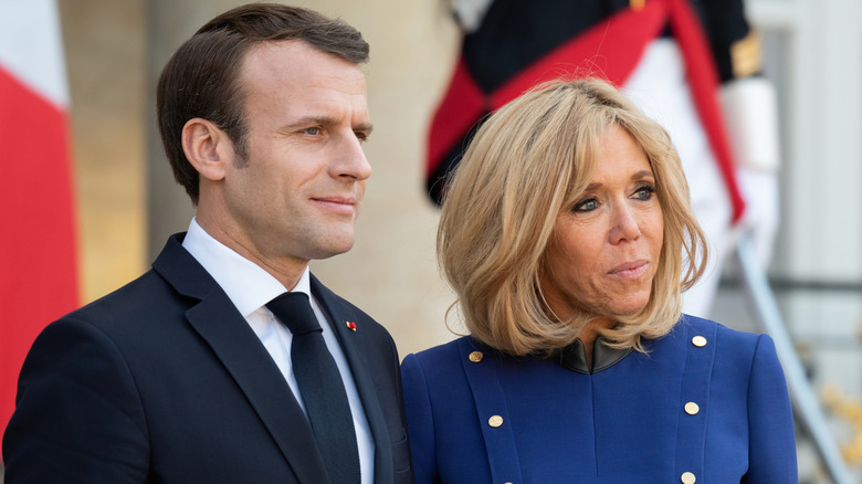 Emmanuel and Brigitte Macron attending an event together