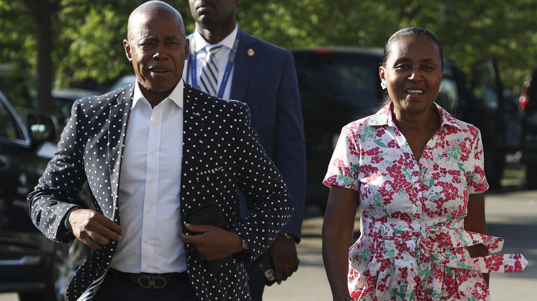 Eric Adams and Tracey Collins walking outside