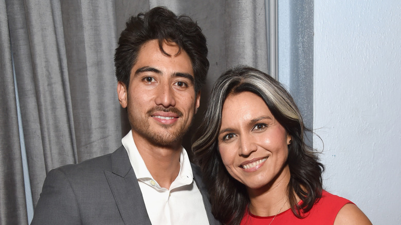 Tulsi Gabbard, right, next to her husband Abraham Williams