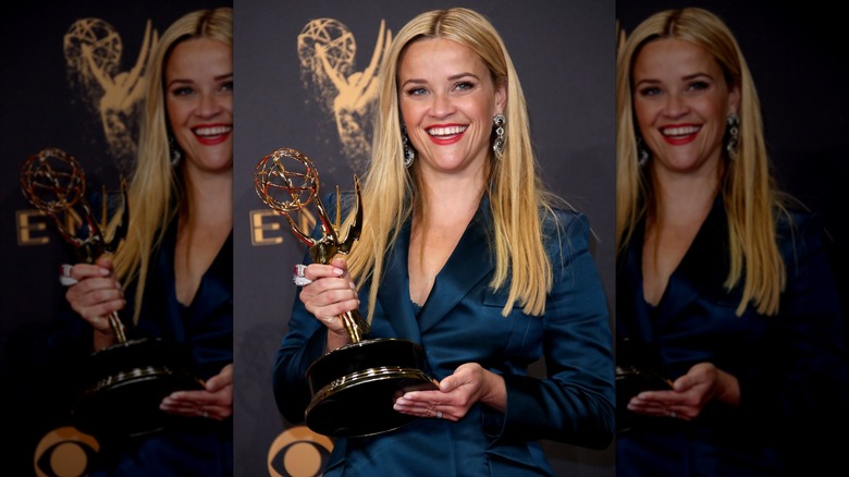 Reese Witherspoon posing with her Emmy