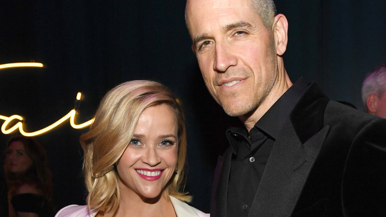 Reese Witherspoon and Jim Toth dressed up at an event