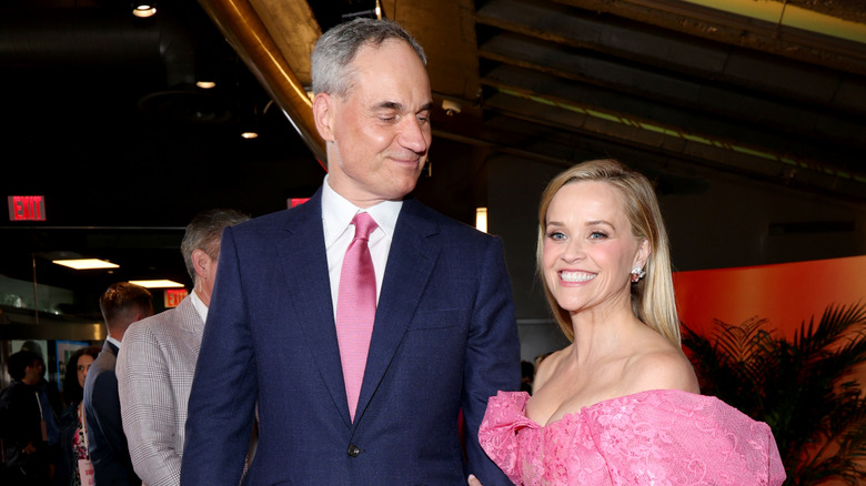 Oliver Haarmann smiling down at Reese Witherspoon at the "Elle" premiere